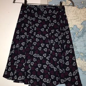 Heart pattern flared over the knee skirt.